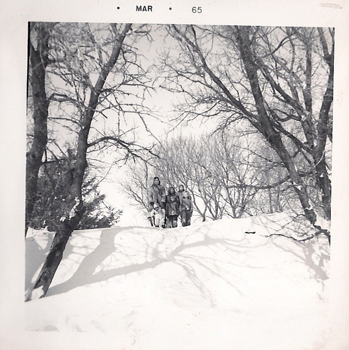 This huge, hard-as-rock snowdrift blocked our farm driveway in this March 1965 photo. I think my uncle drove over from a neighboring farm to help open the drive so the milk truck to reach the milkhouse.