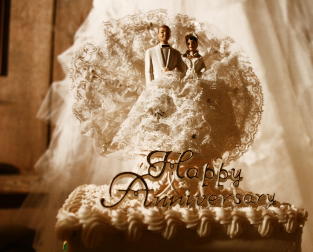 The cake topper from Jeanne and Arnie's wedding with golden anniversary wishes 50 years later.