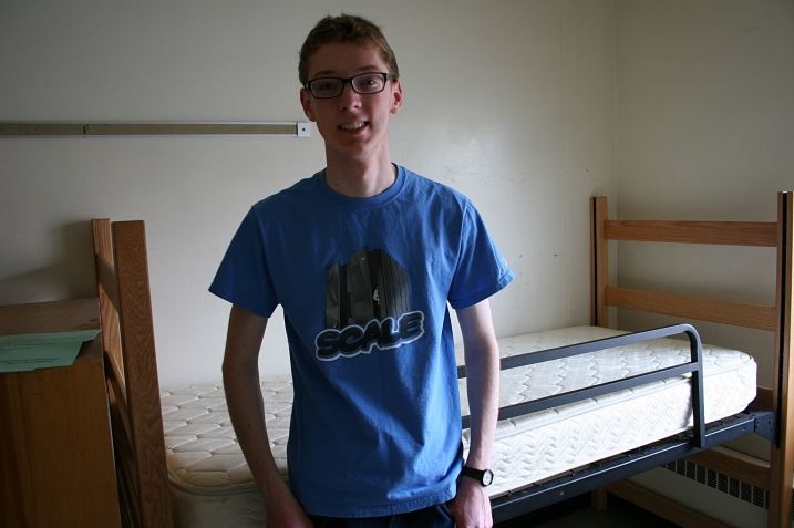 The son poses after packing his belongings in his NDSU dorm room in May.
