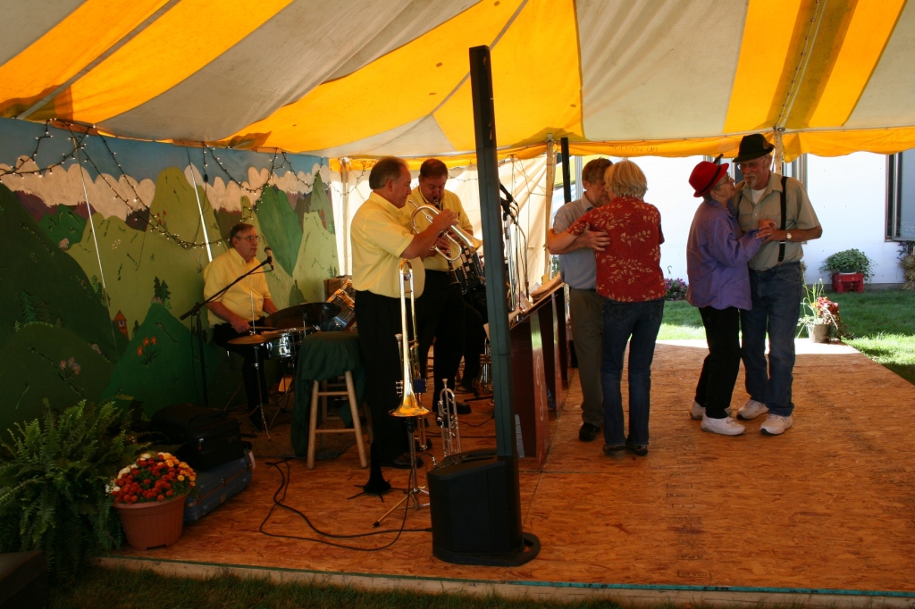 Old-time music drew dancers and listeners to the tent next to the church.