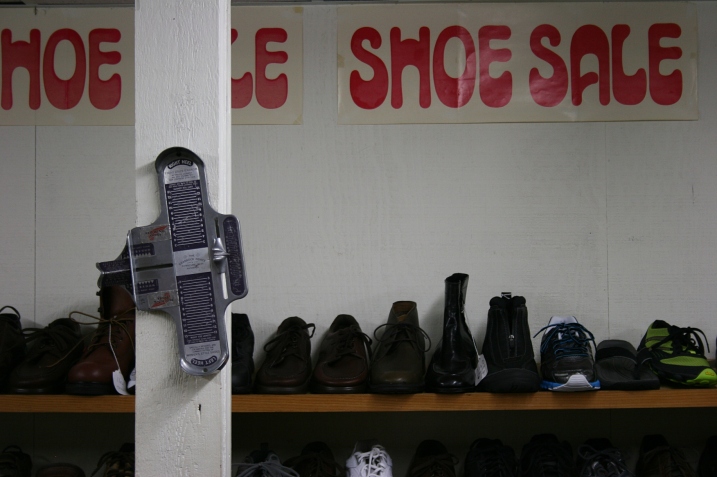 A shoe sale in the back room in the basement.