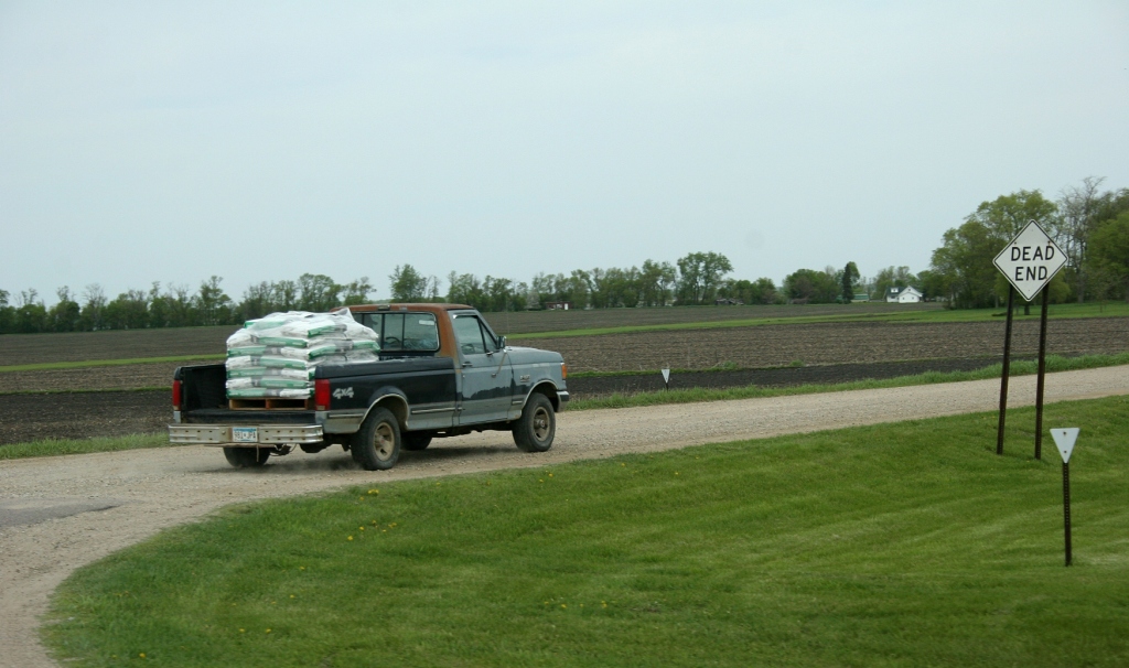 Field work, truck w seed bags west of Mankato