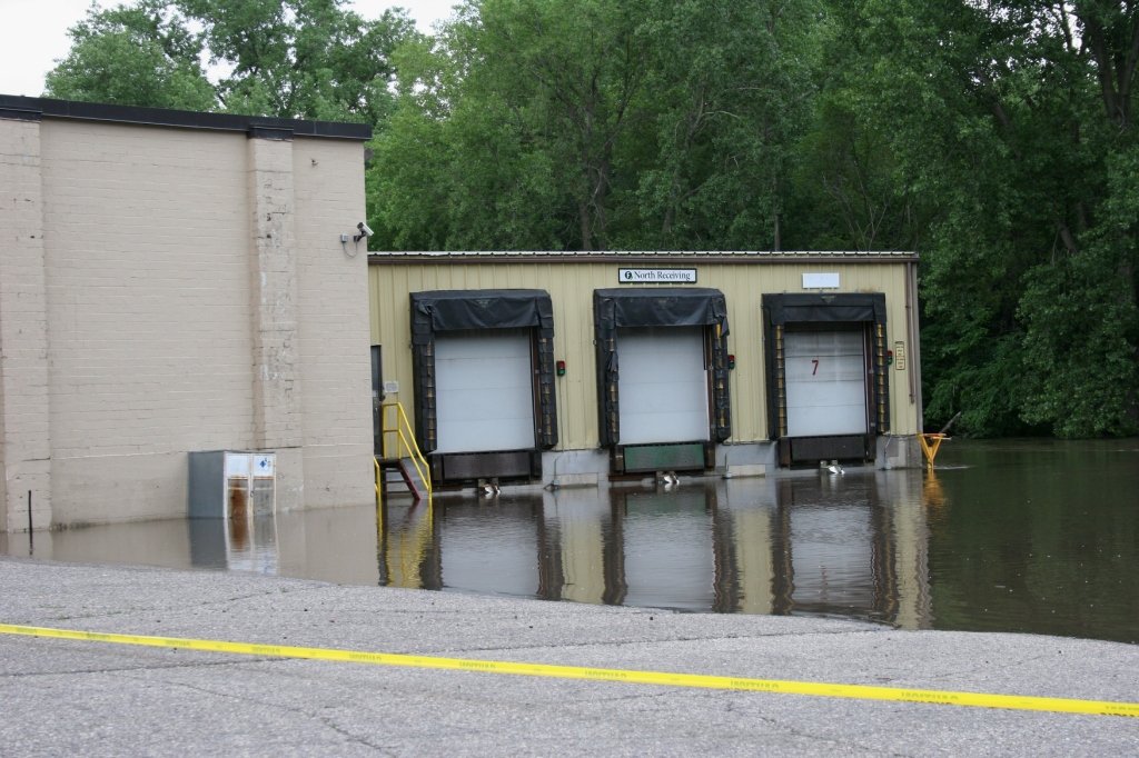 Straight River floodwaters block access to a Faribault Foods loading dock.