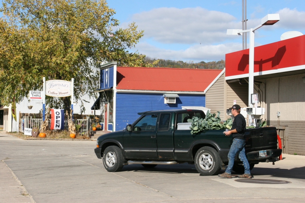 After photographing the hardware store mural, I turned to see this man walking to his pick-up truck parked across the street at River Valley Convenience Store. The business is owned by Doreen and Tom's son Brady and his wife, Tracy. It was the leafy vegetables in the pick-up bed that caught me eye.